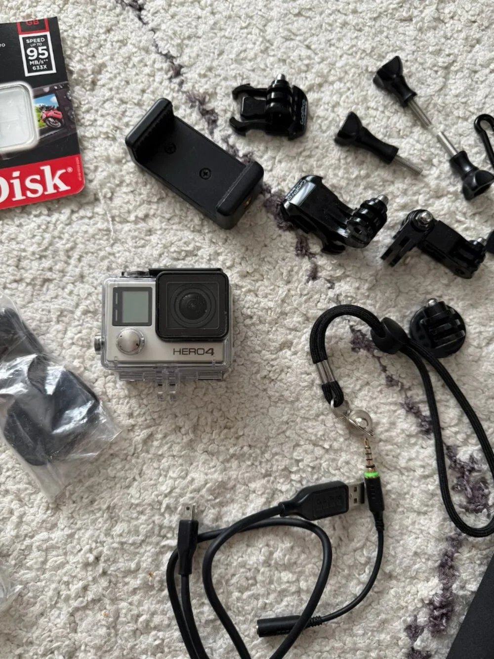 Brand New Go Pro Hero 4 silver waterproof - with selfie stick, 32GB card